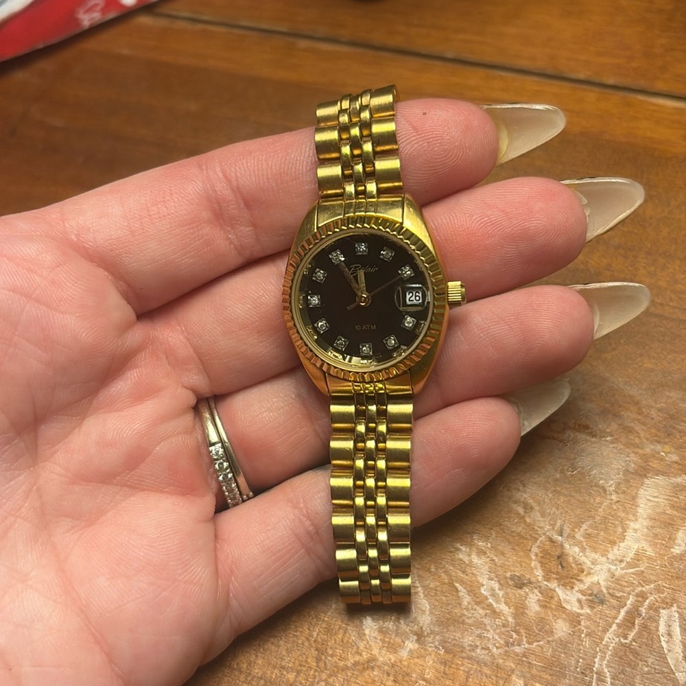 Gold BELAIR watch black face